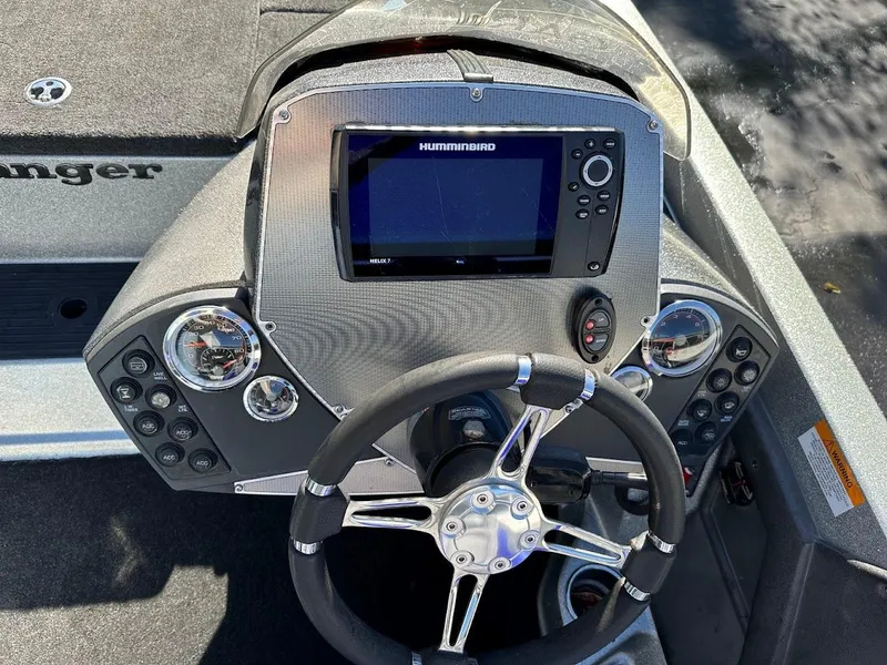 Slide: The Image of 2017 Ranger Z518 boat dashboard with Humminbird fishfinder and steering wheel. - 19