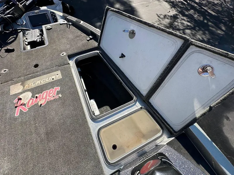 Slide: The Image of 2017 Ranger Z518 boat storage compartments open, showcasing interior space and design. - 30