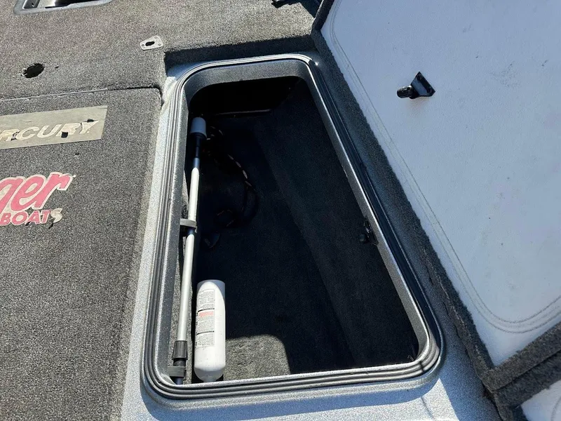 Slide: The Image of 2017 Ranger Z518 boat storage compartment with fishing rod holder. - 32