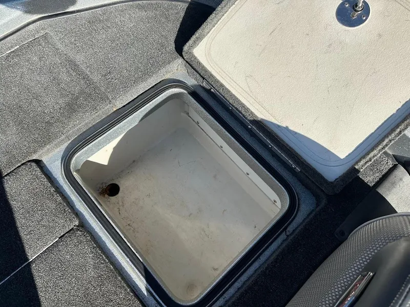 Slide: The Image of Open storage compartment in 2017 Ranger Z518 boat interior. - 38