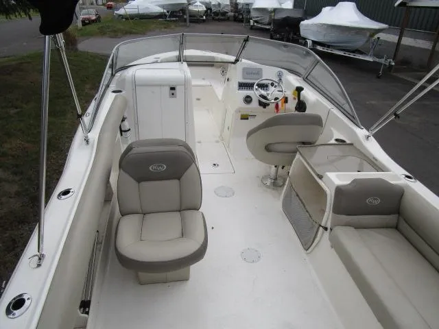 Slide: The Image of 2022 Key West 239 DFS boat interior with seating and steering console. - 11