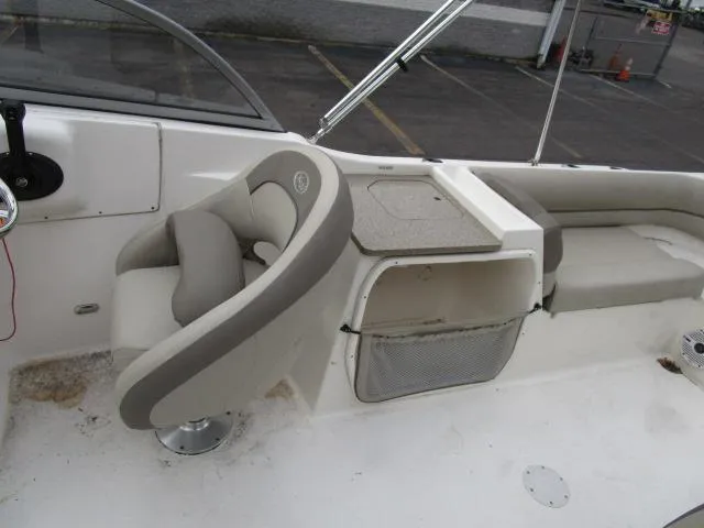 Slide: The Image of 2022 Key West 239 DFS boat interior with seating and storage compartments. - 16