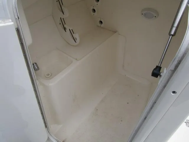 Slide: The Image of Interior of 2022 Key West 239 DFS boat, featuring storage compartment and seating area. - 17