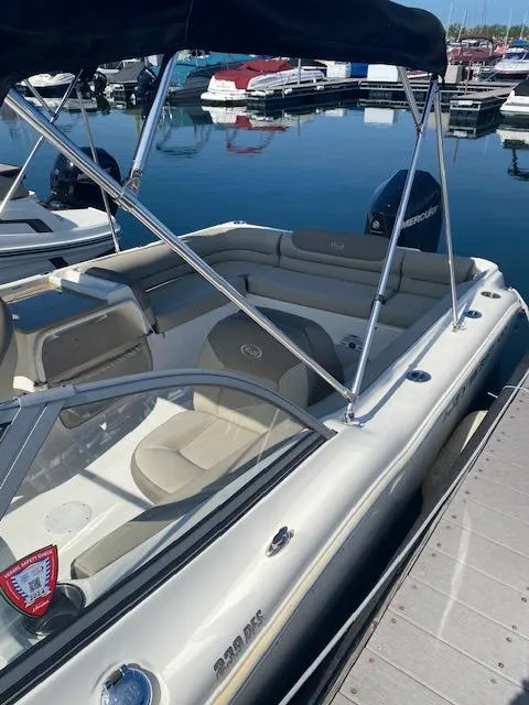 Slide: The Image of 2022 Key West 239 DFS boat docked at marina with canopy. - 2