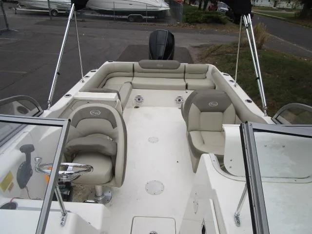 Slide: The Image of 2022 Key West 239 DFS boat interior with seating and steering wheel. - 21