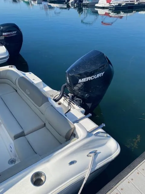 Slide: The Image of 2022 Key West 239 DFS boat with Mercury outboard engine docked in marina. - 3