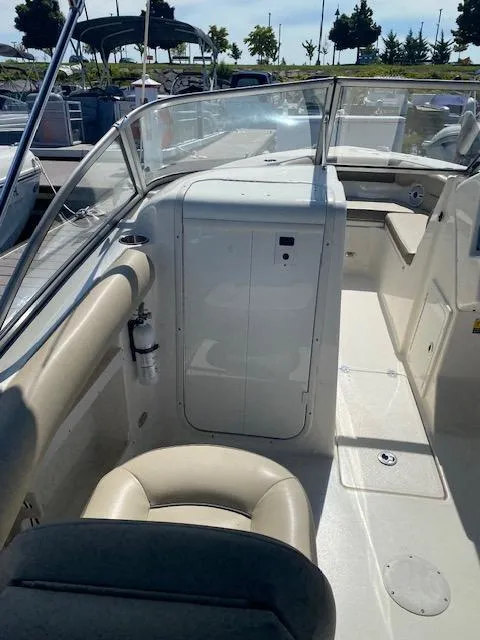 Slide: The Image of 2022 Key West 239 DFS boat interior with seating and console. - 6