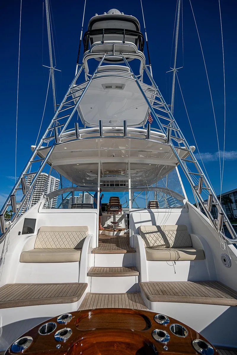 Slide: The Image of 2023 Viking 54 Open yacht with luxurious seating and sleek design. - 18