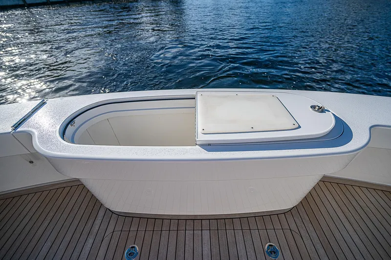 Slide: The Image of 2023 Viking 54 Open yacht deck with sleek design and ocean view. - 22
