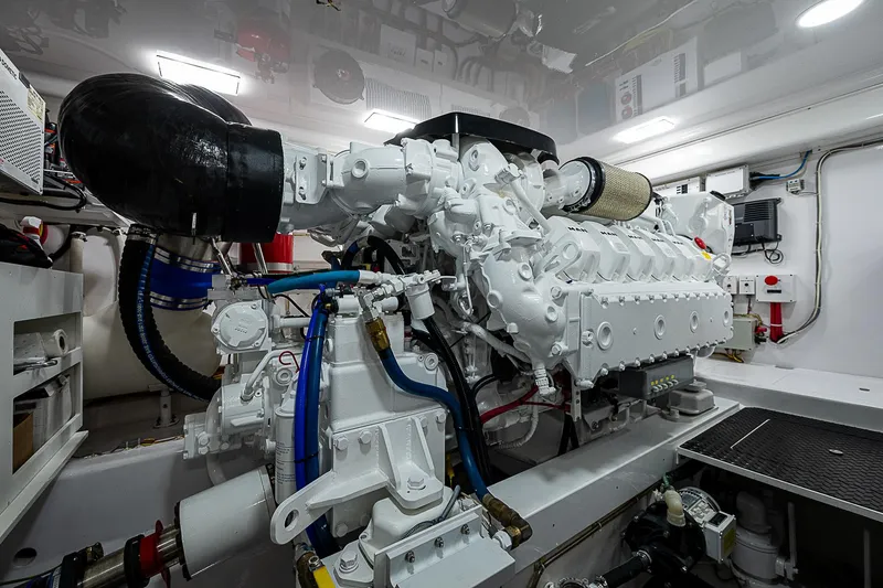Slide: The Image of Engine room of 2023 Viking 54 Open yacht, showcasing advanced machinery and components. - 32