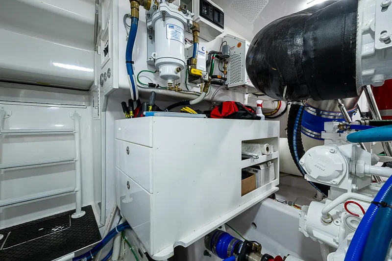 Slide: The Image of Engine room of 2023 Viking 54 Open yacht, showcasing equipment and storage. - 36