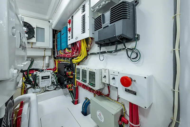 Slide: The Image of Electrical system of 2023 Viking 54 Open yacht, showcasing wiring and control panels. - 37