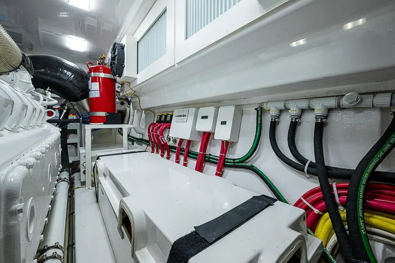 Slide: The Image of Engine room of 2023 Viking 54 Open yacht with wiring and fire extinguisher. - 40