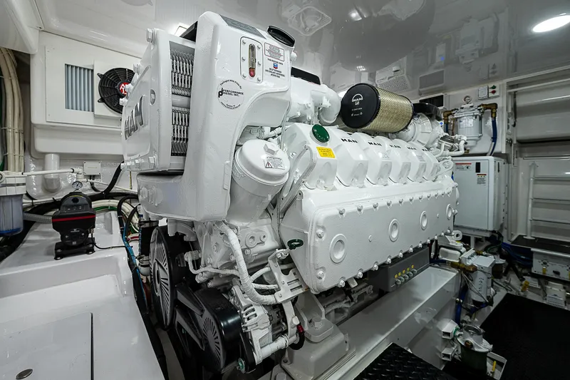 Slide: The Image of Engine room of 2023 Viking 54 Open yacht, featuring a powerful marine engine. - 41