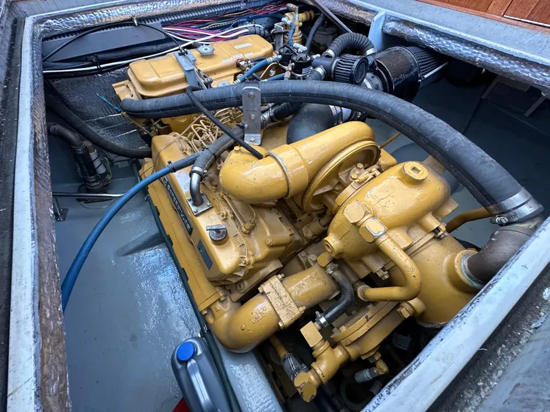 Slide: The Image of Cozy cabin interior of 1994 BHM Lobster Style CUSTOM boat with wooden paneling and blue bedding. - 10