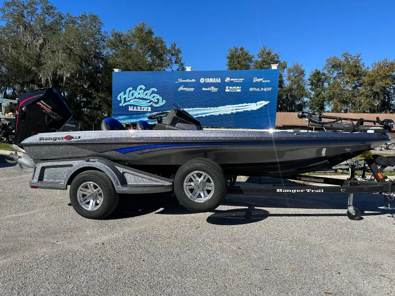 The Image of 2024 Ranger 518 Cup boat on trailer, displayed outdoors. - 0