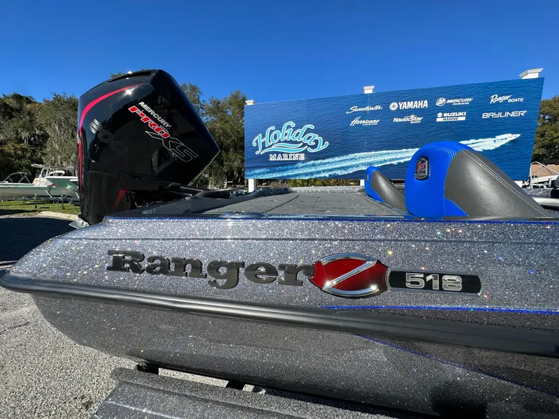 Slide: The Image of 2024 Ranger 518 Cup boat with powerful engine, showcased outdoors. - 11