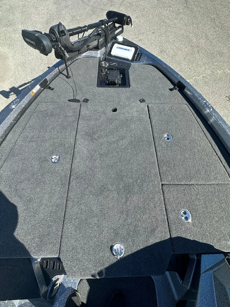 Slide: The Image of 2024 Ranger 518 Cup boat deck with mounted equipment and storage compartments. - 4