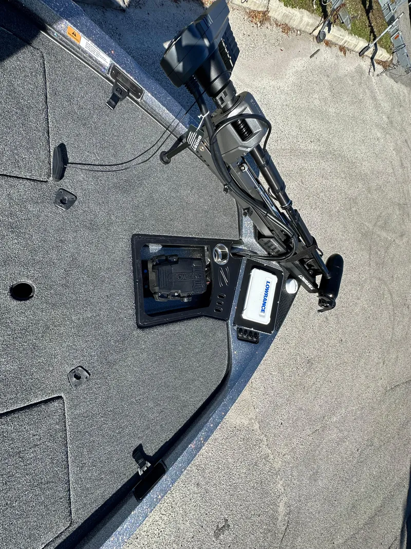 Slide: The Image of 2024 Ranger 518 Cup boat deck with mounted equipment and controls. - 6