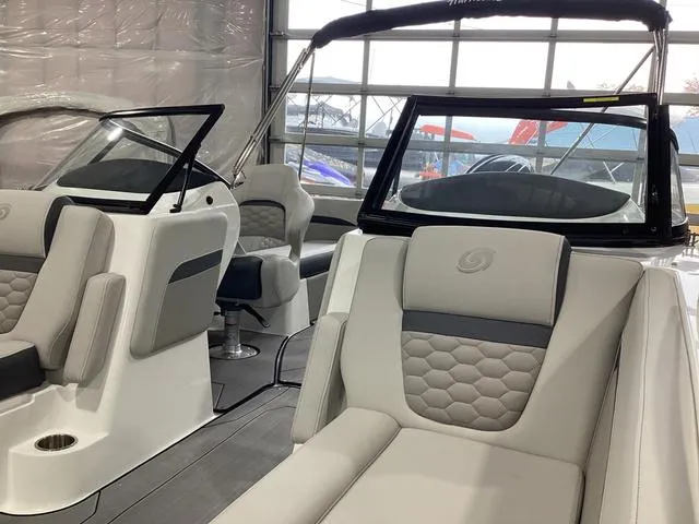Slide: The Image of 2025 Hurricane SunDeck 217 OB boat interior with modern seating and sleek design. - 11