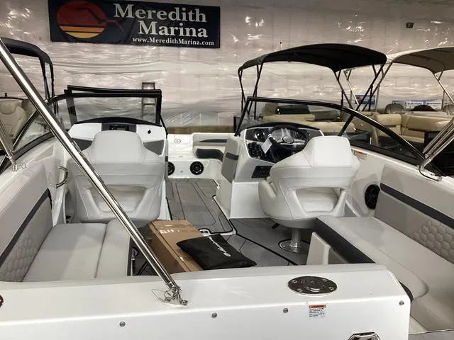 Slide: The Image of 2025 Hurricane SunDeck 217 OB boat interior at Meredith Marina showroom. - 15