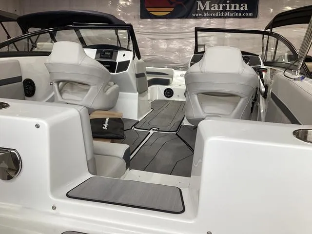 Slide: The Image of 2025 Hurricane SunDeck 217 OB interior with modern seating and sleek design. - 3