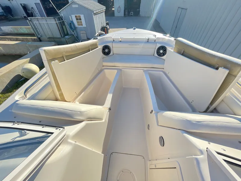 Slide: The Image of 2022 Grady-White Freedom 215 boat interior with spacious seating and storage compartments. - 14