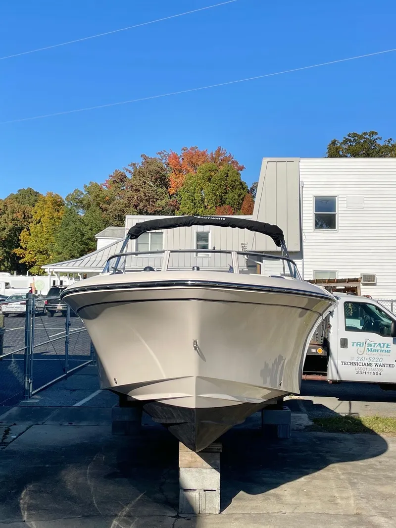 Slide: The Image of 2022 Grady-White Freedom 215 boat on display outdoors. - 3