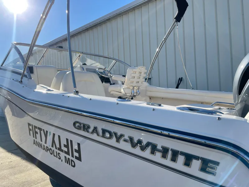 Slide: The Image of 2022 Grady-White Freedom 215 boat docked in Annapolis, MD, under bright sunlight. - 4