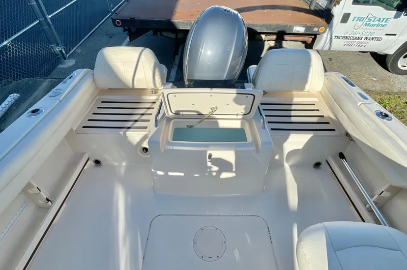 Slide: The Image of 2022 Grady-White Freedom 215 boat interior with seating and storage compartments. - 7
