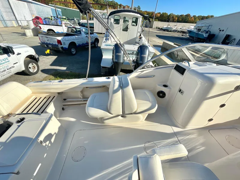 Slide: The Image of 2022 Grady-White Freedom 215 boat interior with seating and controls. - 9