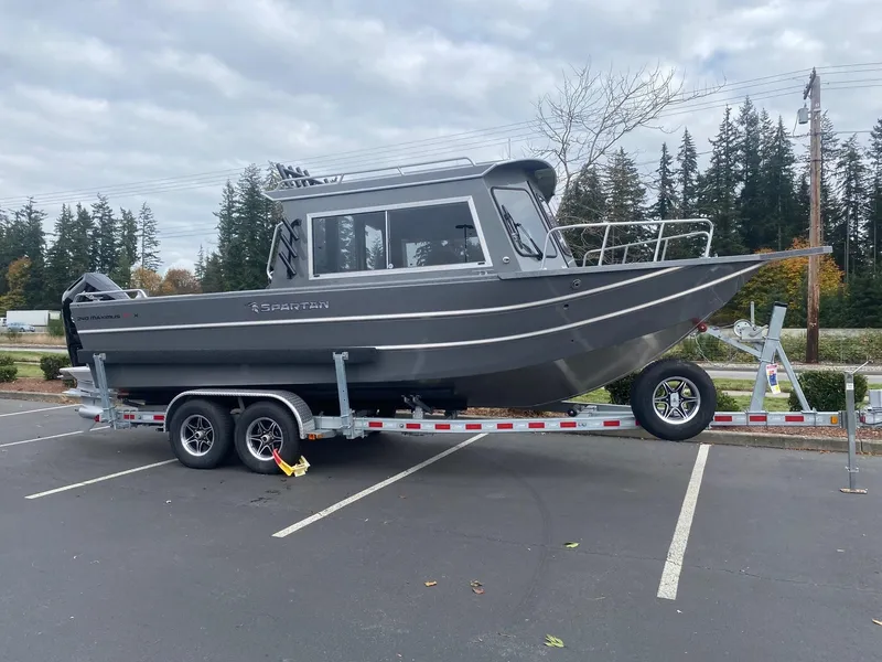 The Image of 2025 Spartan 240 Maximus boat on trailer in parking lot. - 1