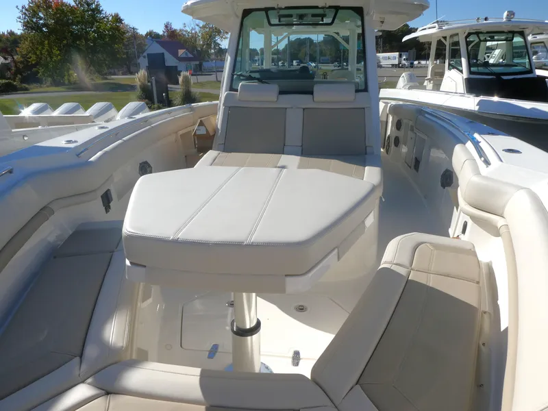 Slide: The Image of 2025 Boston Whaler 380 Outrage boat interior with luxurious seating and modern design. - 10