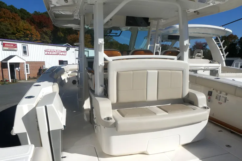 Slide: The Image of 2025 Boston Whaler 380 Outrage boat interior with seating and helm station. - 3
