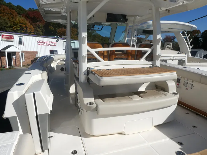 Slide: The Image of 2025 Boston Whaler 380 Outrage boat interior with seating and helm station. - 4