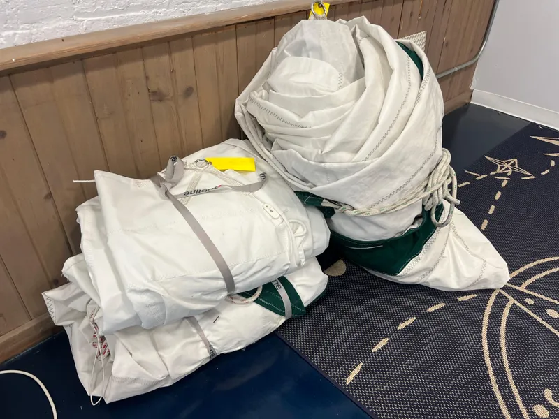 Slide: The Image of Folded sails for a 1987 Bayfield 32C sailboat, neatly stacked indoors. - 10