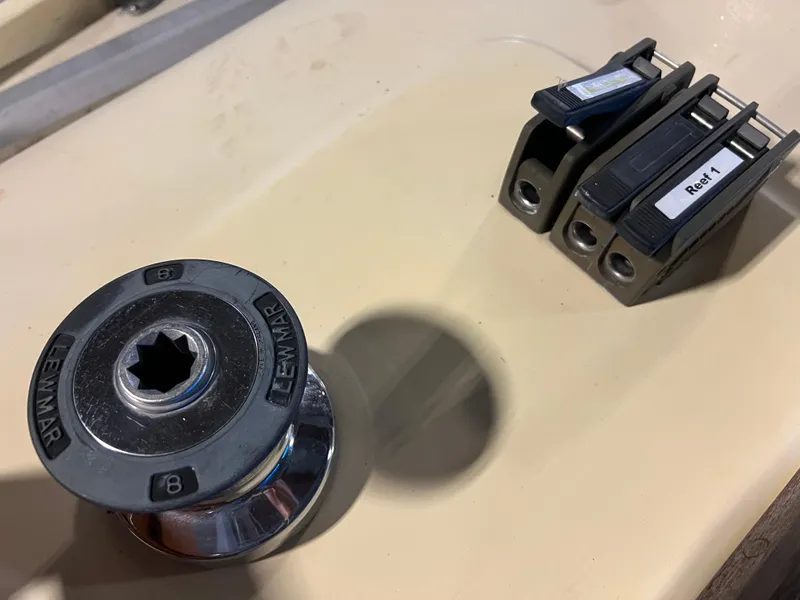 Slide: The Image of Close-up of a 1987 Bayfield 32C sailboat winch and rope clutches on deck. - 16