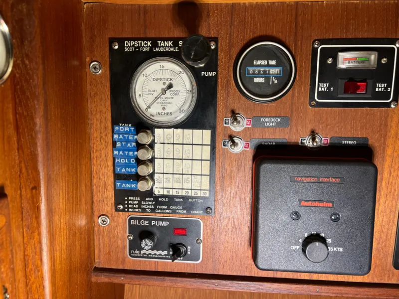 Slide: The Image of Control panel of a 1987 Bayfield 32C sailboat with gauges and switches. - 24