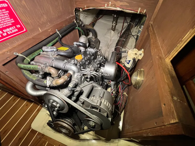 Slide: The Image of 1987 Bayfield 32C engine compartment with visible wiring and components. - 37