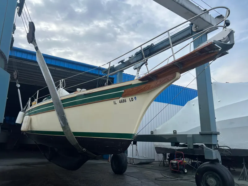 Slide: The Image of 1987 Bayfield 32C sailboat in dry dock, undergoing maintenance. - 40
