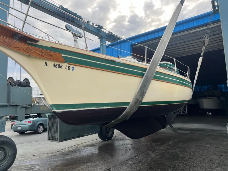 Slide: The Image of 1987 Bayfield 32C sailboat in dry dock, undergoing maintenance. - 41