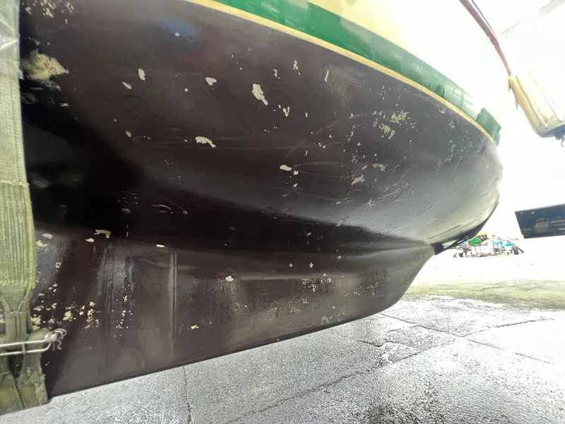 Slide: The Image of 1987 Bayfield 32C sailboat hull with visible wear and scratches. - 48