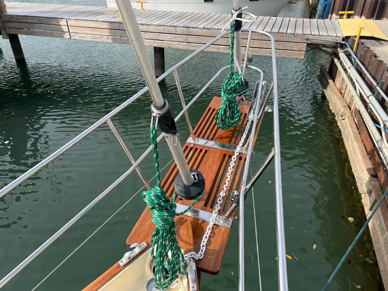 Slide: The Image of Bayfield 32C sailboat bow with green ropes, docked in marina, 1987 model. - 5