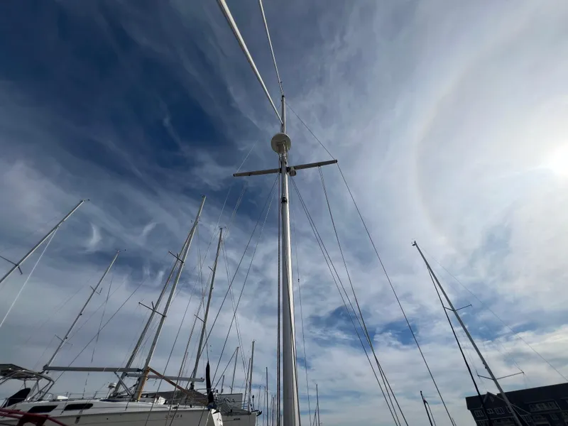 Slide: The Image of Bayfield 32C sailboat mast against a cloudy sky, 1987 model. - 9