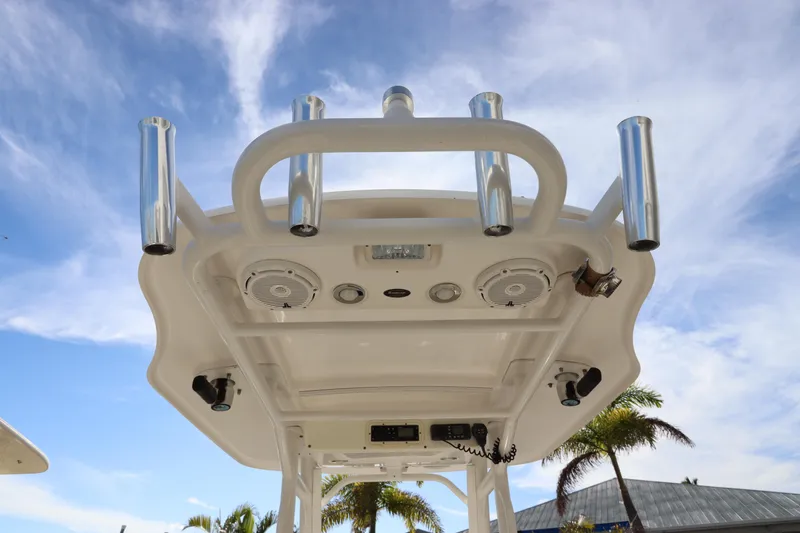Slide: The Image of Everglades 243 Center Console 2012 boat top view with rod holders and speakers. - 18