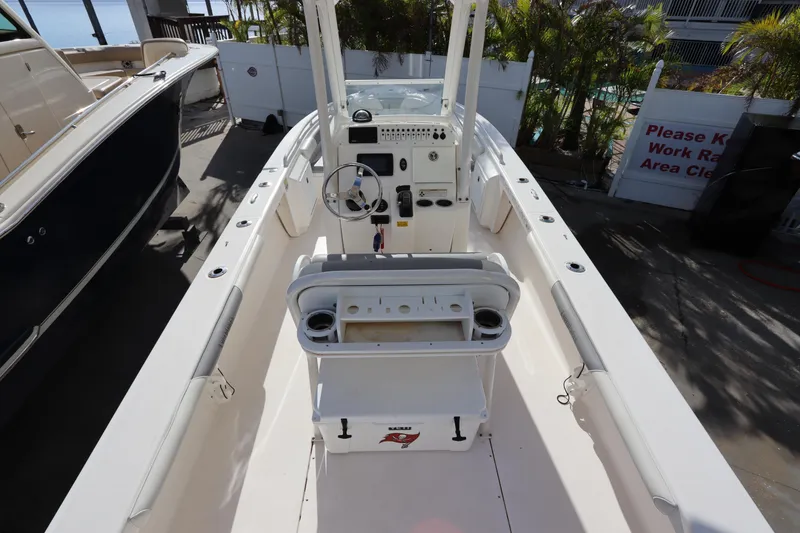 Slide: The Image of 2012 Everglades 243 Center Console boat interior with steering wheel and seating. - 20