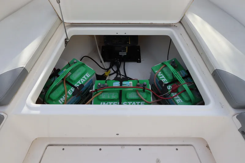 Slide: The Image of 2012 Everglades 243 Center Console boat battery compartment with Interstate batteries. - 28