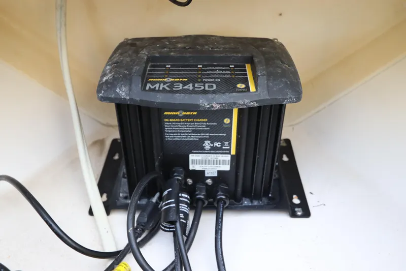 Slide: The Image of Minn Kota MK345D battery charger in 2012 Everglades 243 Center Console boat. - 29
