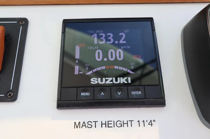 Slide: The Image of Suzuki display on 2019 Back Cove 34O, showing fuel usage and mast height. - 26