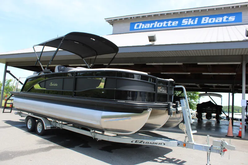 Slide: The Image of 2025 Barletta Lusso 23M pontoon boat on trailer at Charlotte Ski Boats dealership. - 1